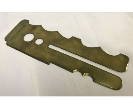 A war department 1955 Brass military button polishing guard. By J.R.G & S 