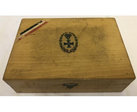 A light wood box with Iron Cross transfer motif to top.  Approx. 26 x 19cm.