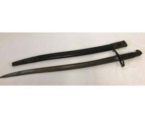 A British 1856 pattern Enfield sword bayonet and black leather scabbard.  