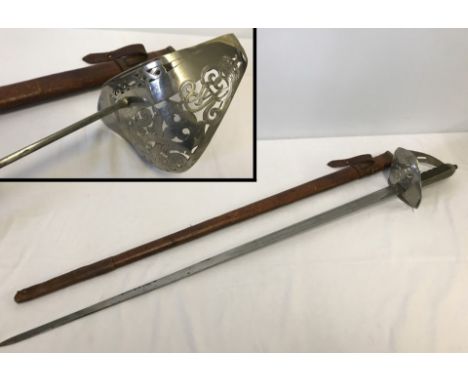 A George V 1897 pattern British Infantry Officer's sword. With original brown leather scabbard. Blade by J. Batson & Sons, Lo