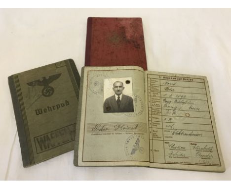 2 WWII German Wherpass books, light green with political eagle to front, contains owners photo. Together with a WWII German w