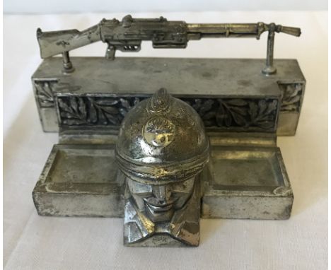 A French Art Deco style pewter inkwell, the well being the head of a French Infantry soldier. Plaque to reverse ' Souvenir du