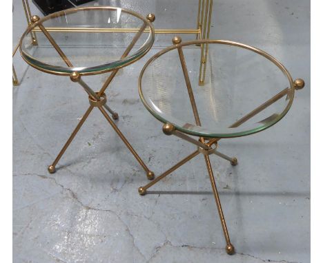 SIDE TABLES, a pair, 1960's French style gilt metal with circular glass tops on tripod bases. (2) 