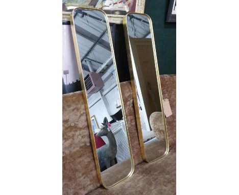 WALL MIRRORS, a pair, 1960's French style, gilt frames, 100cm x 22cm x 4cm. (2) 