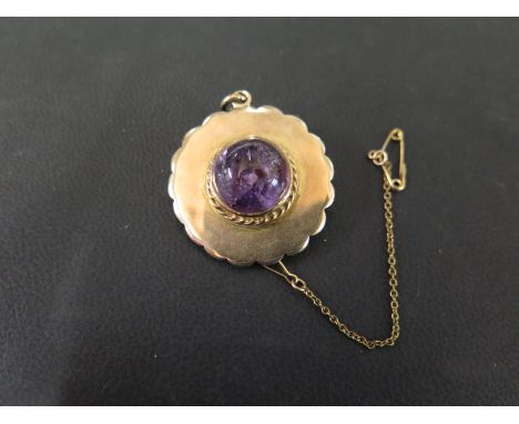 An amethyst cabochon brooch - Stamped 9ct - Diameter 3.2cms - Weight approx 14.0gms
Condition Report: Good to fair - Minor su