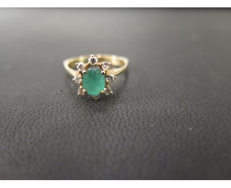 An emerald and diamond cluster ring - To the angular band - Stamped 14K - Ring size M - Weight approx 2.7gms
Condition Report