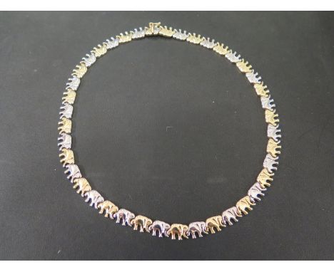 A bi-colour elephant panel necklace - Stamped 585 - Length 44cms - Weight approx 28.5gms
Condition Report: Good - With light 