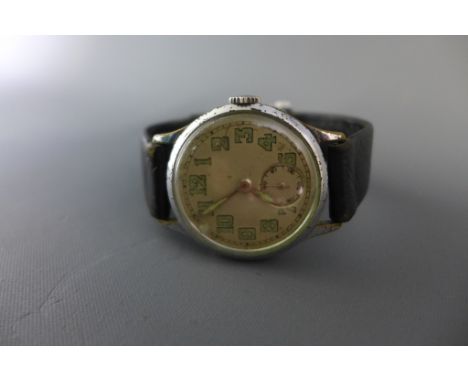 A 1930's Jaeger Le Coultre Gentleman's watch having brass case with cream dial, having broad arrow military style hands and i