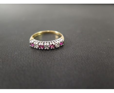 An 18ct gold ruby and diamond seven-stone ring - Hallmarked Birmingham - Ring size K1/2 - Weight approx 2.1gms
Condition Repo