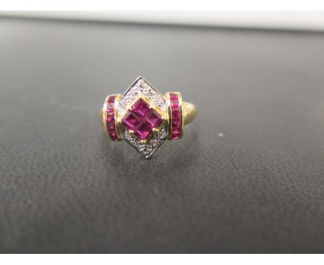 A ruby and diamond panel dress ring - To the ruby shoulders and plain band - Stamped 18K - Ring size N 1/2 - Weight approx 3.