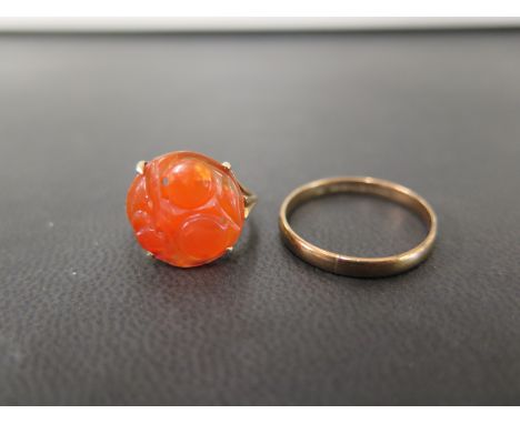 A carved carnelian panel ring - Stamped 9ct - Ring size H - Together with a 9ct gold band ring - Hallmarked Birmingham - Ring