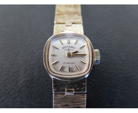 A 9ct gold cased ladies Rotary wristwatch on 9ct gold strap, baton markers to silvered dial - Total approx weight 15 grams
Co