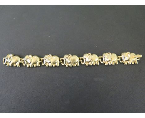 An elephant panel bracelet - Each with brilliant-cut diamond eye - Stamped 14Kt - Length 18cms - Weight approx 36.2gms
Condit