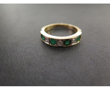 An 18ct gold emerald and diamond seven-stone ring - Hallmarked London - Ring size P - Weight approx 5.0gms
Condition Report: 