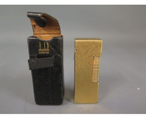 An Alfred Dunhill gilt metal tallboy lighter, in a leather case
Condition report: Good overall condition 