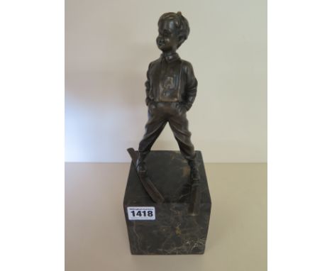 An Art Deco style bronze figure of boy skier on marble base - Height 30cm - new condition
