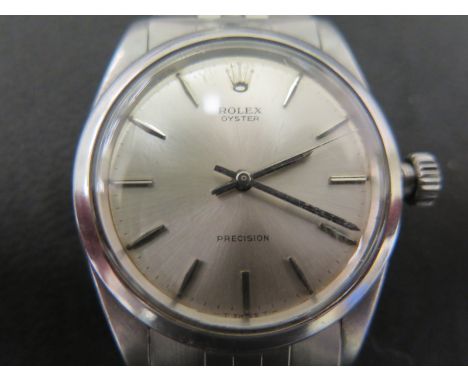 A gentleman's Rolex Oyster Precision wristwatch in stainless steel case, silvered dial with silvered baton markers
Condition 