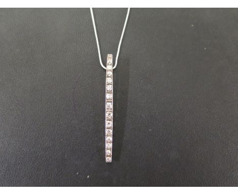 A diamond pendant - The old-cut diamond line, suspended from a coil-link chain - Estimated total diamond weight 1.20cts - Pen