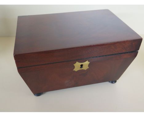 A Regency mahogany sarcophagus shaped tea caddy with later fitted interior, brass cartouche on bun feet - 12cm x 21cm x 14cm