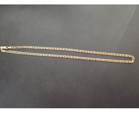 A fancy-link chain - With foreign marks - Tests as higher carat gold - Length 57cms - Weight approx 26.5gms
Condition Report: