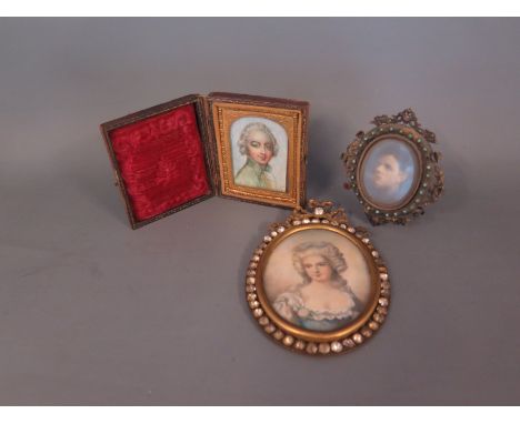 An 18th century style painted miniature in oval frame surrounded by inset white stones with similar period style miniature in