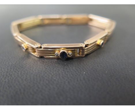 A sapphire and diamond sprung panel bracelet - Stamped Patent 9ct - Total weight approx 14.4gms
Condition Report: Good - With