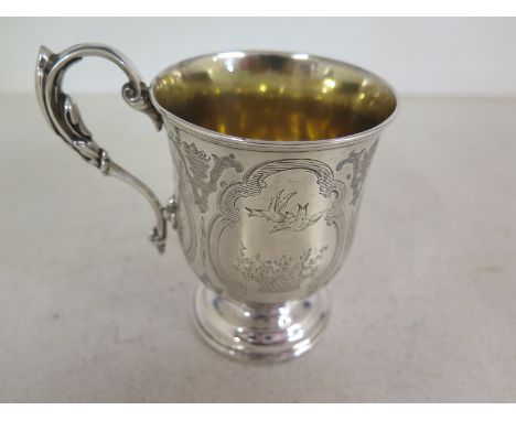 A small gilt lined Victorian tankard, hallmarked Sheffield 1855-56 by Wilkinson and Co. engraved with birds above a basket of