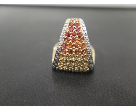 An unusual 9ct gold diamond and gem-set dress ring - Designed as a multi-coloured gem curved triangular panel to the single-c
