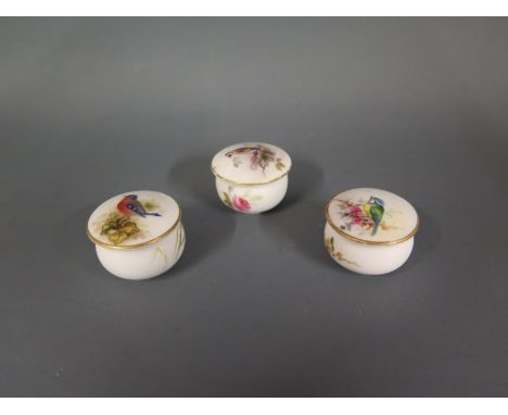 Three early 20th century Royal Worcester trinket pots, hand decorated with birds - Diameter 2.5cm each - fair condition, wear