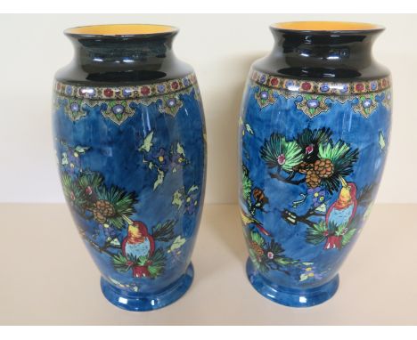 A pair of Carltonware vases - Bird and Pine cone design - Height 26cm 
Condition report: Crazing to both, no obvious damage o