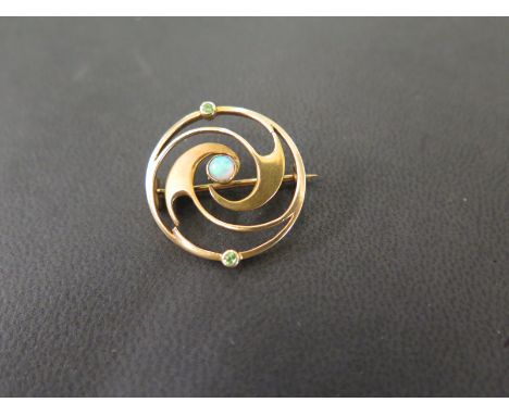 An opal and green-gem swirl brooch - Tests as higher carat gold - Diameter 2.5cms - Weight approx 3.8gms
Condition Report: Go