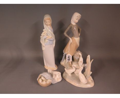 Lladro - Three ornaments comprising a small goose and gosling with two tall girl figures with additional Nao goose ornaments
