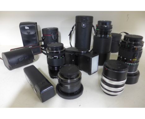 Four Canon A1 camera lenses, a 70-210, a28mm, 130mm, 35-105 zoom - and a Canon auto series auto winder in case