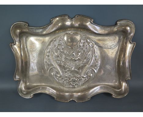 An Edwardian/Art Nouveau silver tray having circular relief moulded central cartouche with foliate decoration -Total weight a