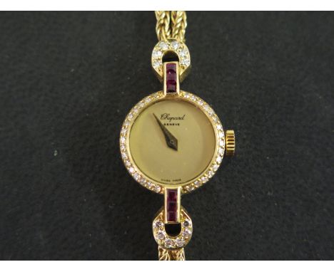 A modern 18ct gold Chopard ladies cocktail watch having mottled matt 10mm gilt dial with gilt arrow hands surrounded with dia