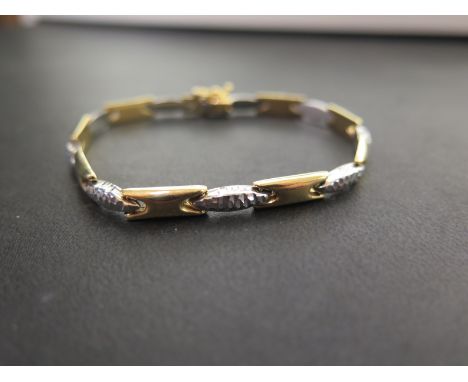A bi-colour panel bracelet - Stamped 750 (indicating 18ct gold) - Length 19cms - Weight approx 11.5gms
Condition Report: Good