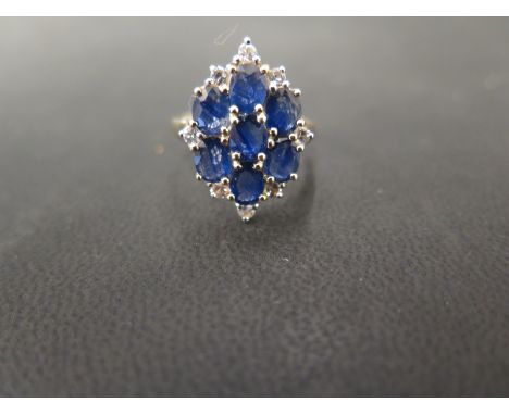 A 9ct gold sapphire and white-gem cluster panel ring - Hallmarked Birmingham - Ring size N 1/2 - Weight approx 3.3gms
Conditi