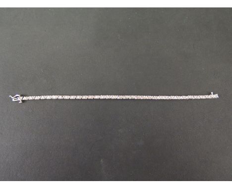 A diamond panel bracelet - Estimated total diamond weight 0.70ct - Stamped 10K - Length 18cms - Weight approx 9.7gms
Conditio