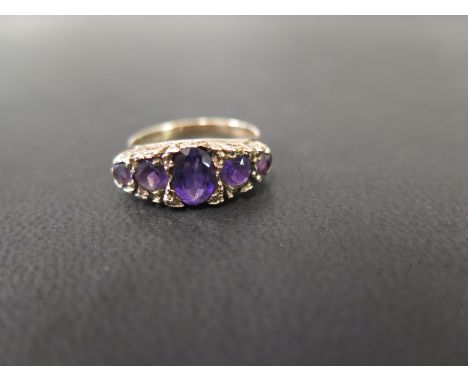 A 1970s amethyst five-stone ring - Hallmarked London, 1977 - Ring size M 1/2 - Weight approx 3.4gms
Condition Report: Good - 