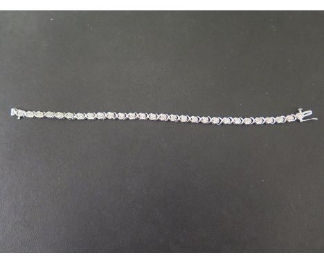 A 9ct gold diamond panel bracelet - Designed as a series of floral panels, each set with a brilliant-cut diamond, to the cros