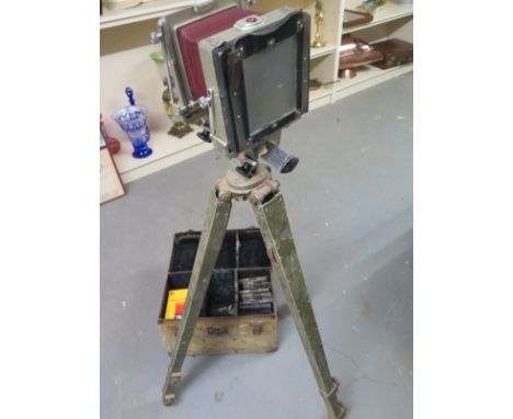 A 1950's plate camera by Graphic View with three lenses, multiple plates in original carry case and tripod 