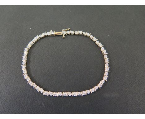 A 9ct gold diamond line bracelet - With curved bar spacers - Hallmarked Sheffield - Length 19cms - Weight approx 5.2gms
Condi