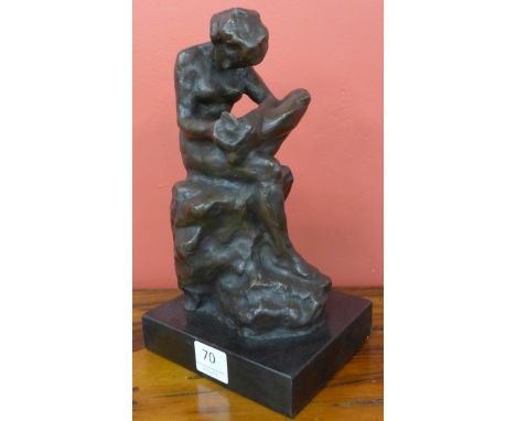 A French style bronze figure of girl with thorn, on black marble socle