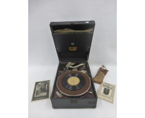 An early 20th Century His Master's Voice windup tabletop gramophone with an assortment of broadcast, His Master's Voice and R