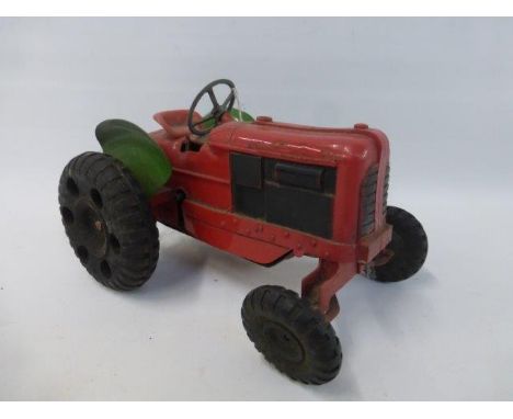A Tri-ang Minic clockwork tractor.