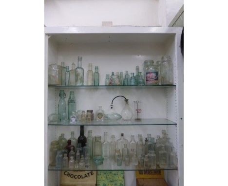 A selection of glass bottles including one marked Spain & Albury, another R. White of Camberwell etc.