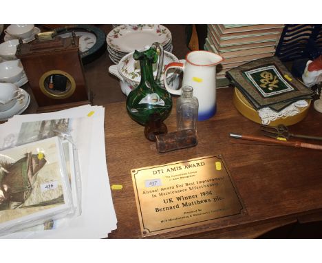 A Bernard Matthews 1994 award plaque; a green glass jug with lily decoration; a vintage glass bottle and a pair of opera glas