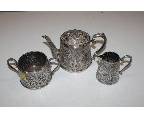 An Eastern silver three piece tea set with engraved monogram to base, approx. total weight 43oz