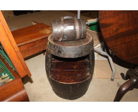 An  oak barrel converted to a side table; a small oak barrel and a 19th Century mahogany commode