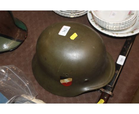 A German WWII type double decal helmet